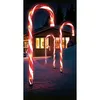 Christmas candy cane lights in the snow outside a house at night. Náhľad obrázku produktu