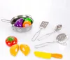 A collection of toy kitchenware and play food items arranged on a white background. Náhled obrázku produktu