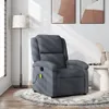 A dark gray massage recliner is placed on a rug in a room with a floor lamp and artwork on the wall. Podgląd zdjęcia produktu