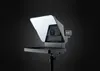 A teleprompter device is shown against a dark background. Náhľad obrázku produktu