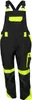 A pair of black and yellow work overalls. Produktbild-Vorschau