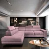 A modern living room with a pink sectional sofa, shelves in the background, and a coffee table in the foreground. Podgląd zdjęcia produktu