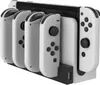 A white charging dock for Nintendo Switch Joy-Cons, with four controllers attached. Produktbild-Vorschau