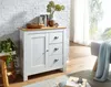 A white sideboard with a wooden top is shown in a living room setting, next to a window with sheer curtains. Podgląd zdjęcia produktu