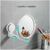 A bathroom mirror with suction cup mounting is shown, with a hand holding a lipstick in front of it and another lipstick reflected in the mirror. Arrows indicate rotation points. Produktbild-Vorschau