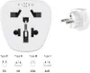 A white universal travel adapter and a white European plug are shown against a white background, with diagrams of different plug types below. Produktbild-Vorschau