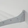 A close-up view of a gray wall-mounted drying rack attached to a white wall. Produktbild-Vorschau
