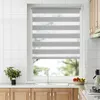 A kitchen window with blinds, a sink, and cabinets. Produktbild-Vorschau