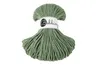 A spool of green macrame cord with a label. Anteprima dell’immagine prodotto