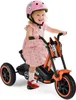 A young child is riding a toy motorcycle. Produktbild-Vorschau