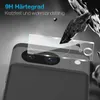 A close-up of a smartphone camera lens protector being applied to a phone, with dramatic lighting and debris suggesting protection against impact. Produktbild-Vorschau