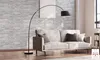 A living room scene featuring a sofa and a floor lamp. Produktbild-Vorschau