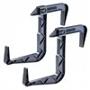 Two black plastic balcony box handles are shown against a white background. Podgląd zdjęcia produktu