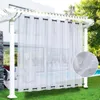 Outdoor curtains hanging from a pergola, with a pool and backyard visible in the background. Produktbild-Vorschau