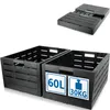 Two black plastic storage crates are shown in the foreground, with a folded plastic pallet in the background. One crate has two square white labels with blue text and icons. Produktbild-Vorschau