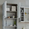 A bathroom cabinet with open doors, showing shelves stocked with towels and toiletries. Produktbild-Vorschau