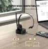 A black wireless headset with a charging stand is placed on a wooden desk next to a laptop and a smartphone. Produktbild-Vorschau