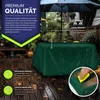 A green tarp covering a table outdoors in the rain, with promotional text and icons. Podgląd zdjęcia produktu