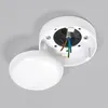 A white ceiling junction box with wires exposed, with its cover partially detached. Produktbild-Vorschau