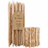 Two bundles of wooden stakes, one taller than the other, bound by wire. A tag is attached to the taller bundle.