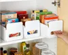 Kitchen or pantry shelves with various food products and organizers. Produktbild-Vorschau