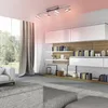 A modern living room with a ceiling light, shelves filled with books and decor, and a large window overlooking a garden. Produktbild-Vorschau