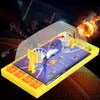 A tabletop basketball game with a yellow base, blue court, and basketball hoops. Produktbild-Vorschau