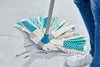 A person is cleaning a floor with a mop. Náhľad obrázku produktu
