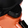 A close-up view of a black vent with a honeycomb pattern on an orange tool. Produktbild-Vorschau
