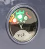 A close-up of a volt meter gauge on a device. Produktbild-Vorschau