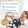 A child is playing with feathers, surrounded by marketing text about a down comforter. Produktbild-Vorschau