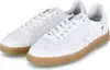 A pair of white athletic shoes with brown soles. Produktbild-Vorschau