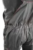 Close-up of a person wearing gray overalls with orange stitching. Produktbild-Vorschau