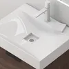 A close-up view of a modern white sink with a sleek faucet and a dark wood cabinet underneath. Produktbild-Vorschau