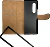 An open book-style phone case with a brown exterior and a black interior holder for a phone. Podgląd zdjęcia produktu