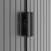 A close-up view of a black handle on a gray corrugated metal surface. Náhľad obrázku produktu
