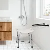 A bathroom scene with a shower, vanity, and a shower stool. Voir les images du produit