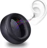 A close-up of a black headphone earpad with colorful musical notes and sound waves emanating from it, leading towards a stylized white ear. Produktbild-Vorschau