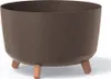 A brown planter pot with three wooden legs, shown against a white background. Náhľad obrázku produktu