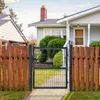 A metal garden gate is shown in front of a house, with a wooden fence on either side. Produktbild-Vorschau
