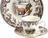A close-up view of a porcelain teacup and saucer set with a decorative pattern, placed on a matching plate. Náhľad obrázku produktu