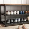 A shoe rack with multiple shelves displaying various shoes. Podgląd zdjęcia produktu