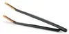 A pair of black kitchen tongs with gold tips, shown against a white background. Produktbild-Vorschau