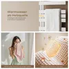 A collage of images showing a towel warmer, a woman drying her face with a towel, and a close-up of a textured fabric with protective elements. Podgląd zdjęcia produktu