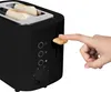 A hand is shown pressing the lever of a black toaster with two slices of bread inside. Produktbild-Vorschau