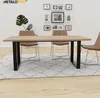 A dining table and chairs set in a modern room with framed pictures on the wall. Anteprima dell’immagine prodotto