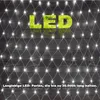 A net light string with the word LED made of grass in the center, against a dark wooden background. Produktbild-Vorschau