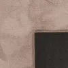 A close-up view of a rug, showing the texture of the pile and the non-slip backing. Produktbild-Vorschau