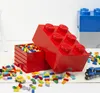 A collection of LEGO storage bricks and loose LEGO bricks scattered on a rug. Voir les images du produit