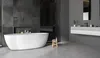A modern bathroom with a freestanding bathtub, a wall-mounted vanity, and dark tiled walls. Produktbild-Vorschau